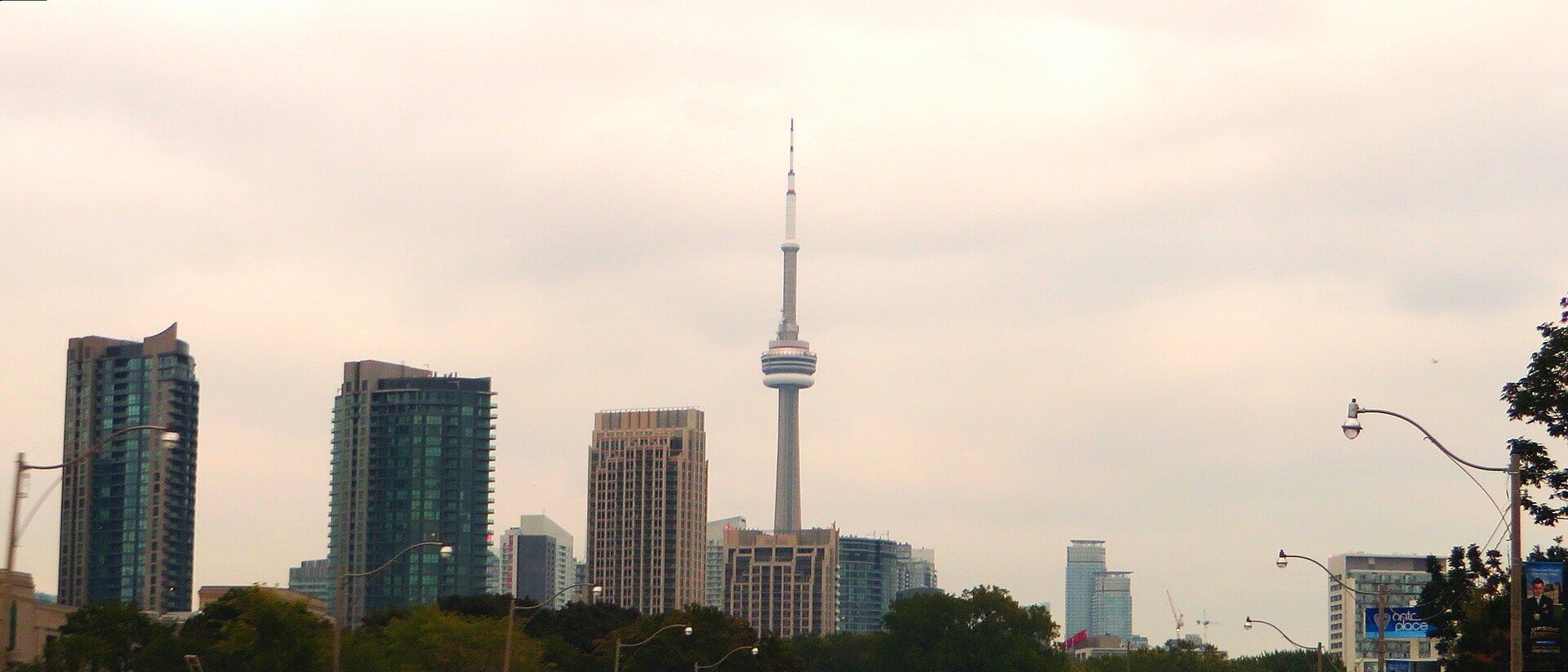 The tower standing in the downtown skyline, seen from the water
